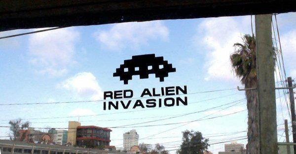 Red Alien Invasion TJ Window Reflection